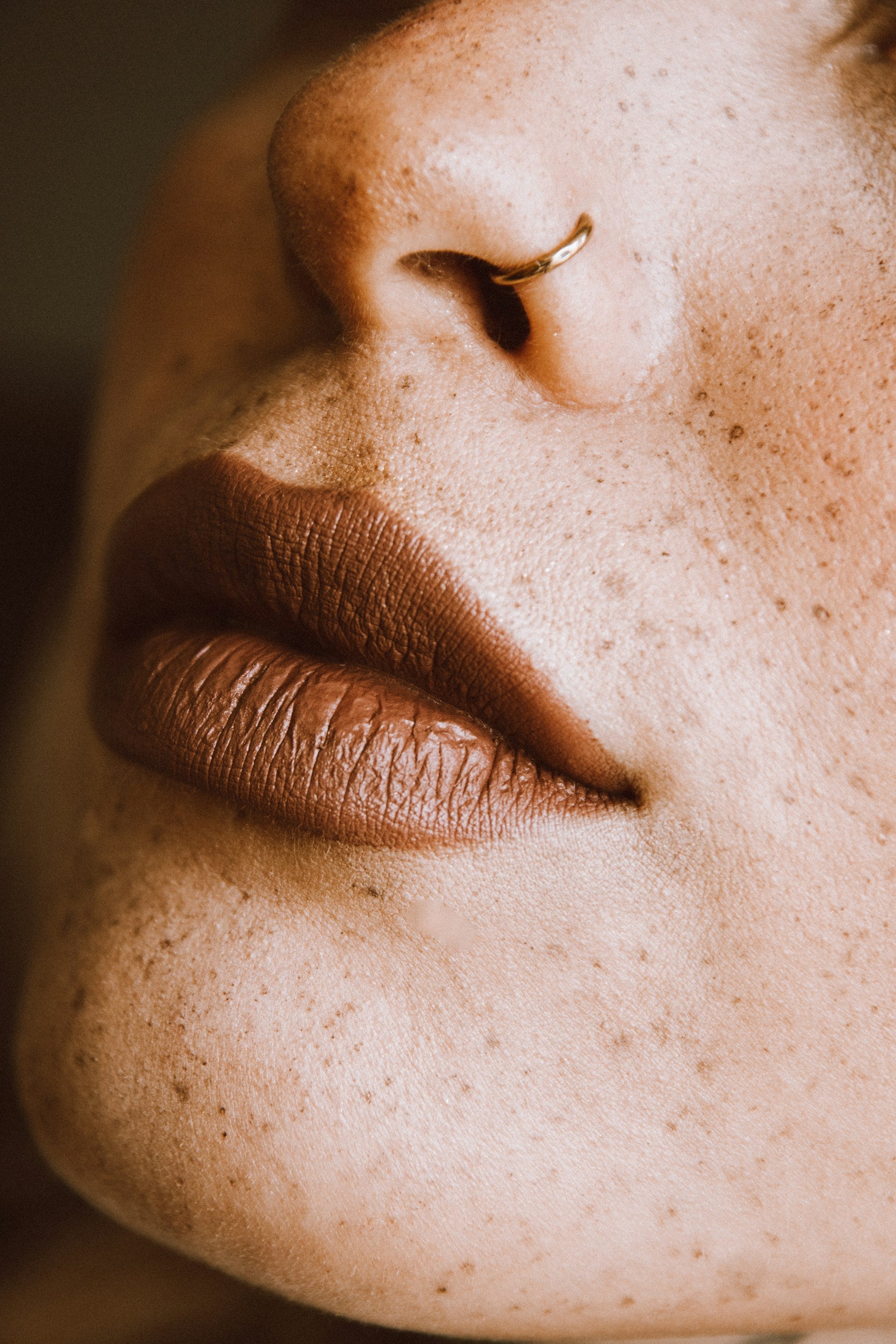 Close up of woman with flawless skin and freckles